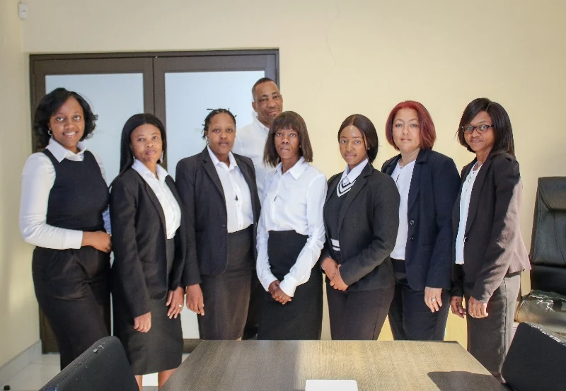 Members of the firm’s team gathered in the office