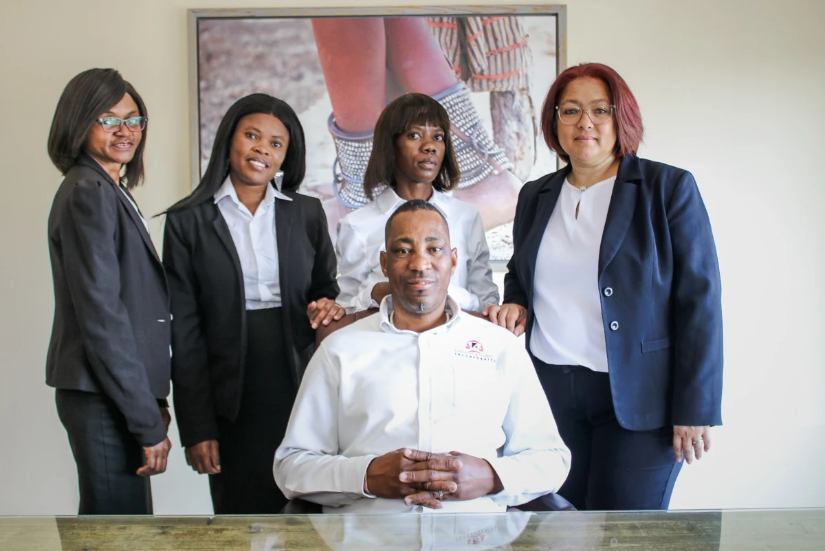 Members of the firm’s support staff together in the office